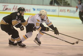 Liam Kidney of the Cape Breton Eagles, right, battles for the puck with Anthony Hamel of the Charlottetown Islanders during Quebec Major Junior Hockey League action at the Eastlink Centre in Charlottetown on Friday. The Islanders won the game 7-2.