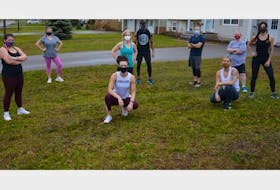Summerside-based trainer Dan Archibald, back row, centre, poses with a group following a fitness class.