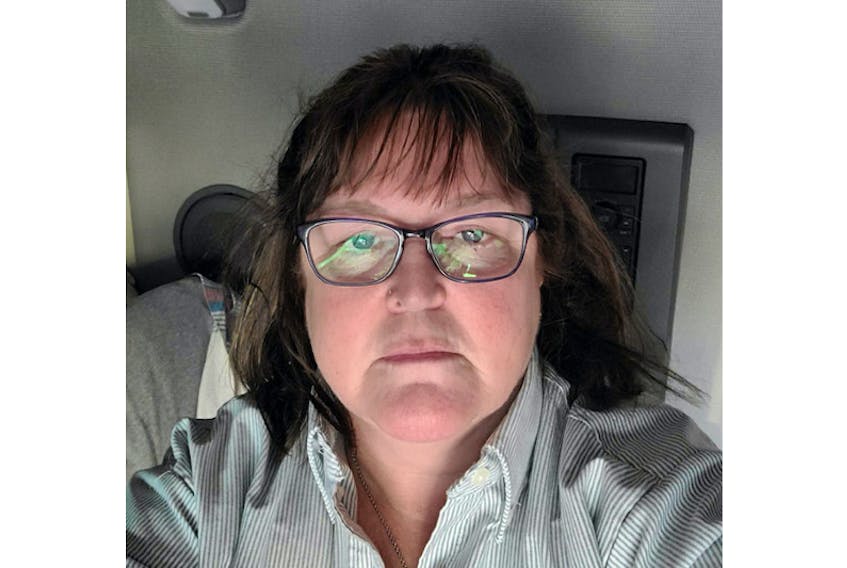 Anne Quinn takes a break in the bunk of her long-haul truck in New Jersey on Thursday. Quinn has been floored by the kindness of the Islanders who have come to her aid after she lost $2,700 in a rental scam.