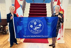 Lt.-Gov. Antoinette Perry, right, joins Corrine Hendricken-Eldershaw, CEO, in raising the Alzheimer Society flag at Fanningbank recently to launch Alzheimer Awareness Month. During this month, the Alzheimer Society of P.E.I. will be launching a social awareness campaign, #ConnectionsMatter, to fight the stigma and build connection.