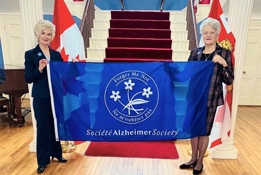 Lt.-Gov. Antoinette Perry, right, joins Corrine Hendricken-Eldershaw, CEO, in raising the Alzheimer Society flag at Fanningbank recently to launch Alzheimer Awareness Month. During this month, the Alzheimer Society of P.E.I. will be launching a social awareness campaign, #ConnectionsMatter, to fight the stigma and build connection.