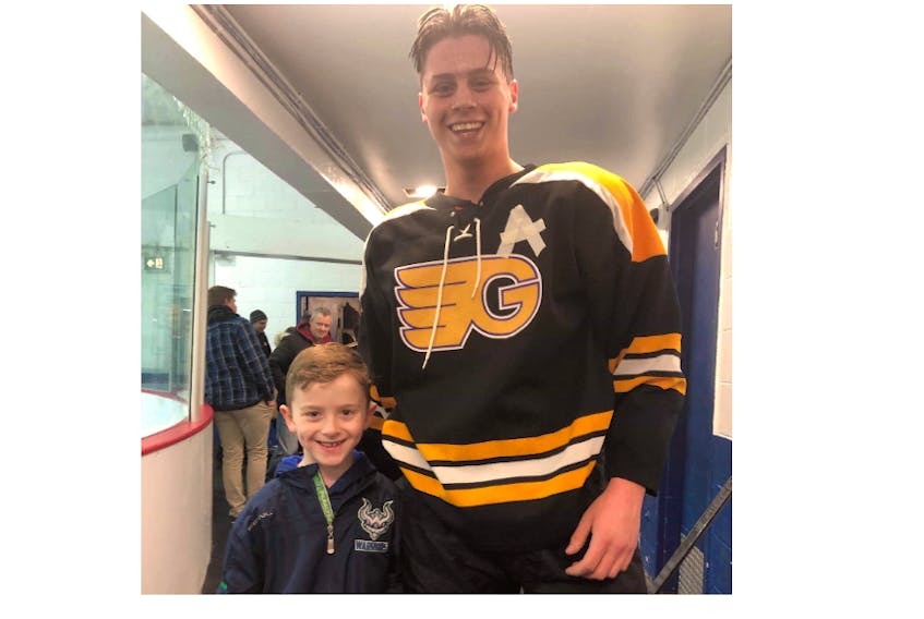 Alex Stares, right, poses for a photo with Liam Bennett during the midget A provincial tournament held in St. John's at Easter.
