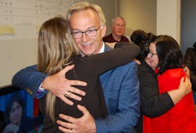 Liberal incumbent Sean Casey hugs a supporter at his election viewing party on Oct. 21. Casey held on to his seat in the Charlottetown riding.