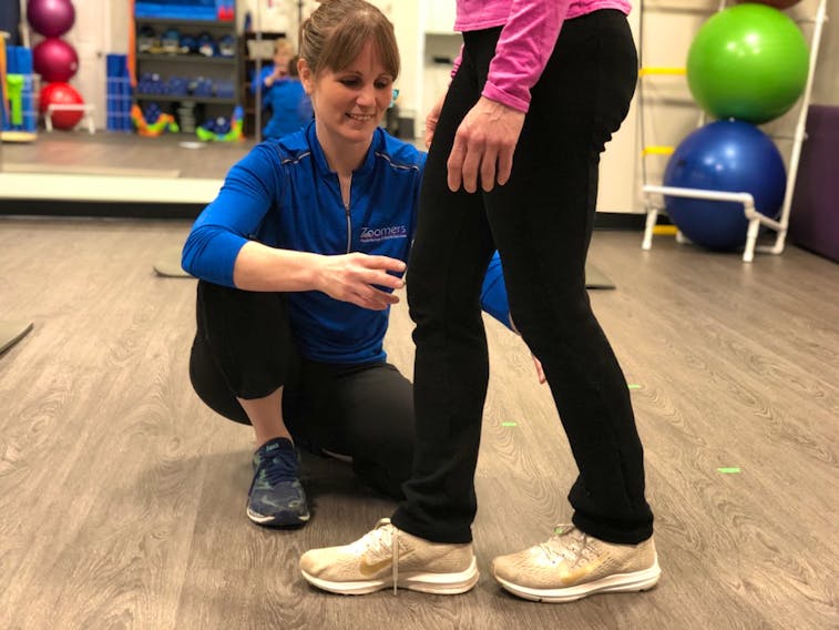 Susan Ross demonstrates the tandem stance position, while being supervised by Laura Lundquist from Zoomers Physiotherapy and Health Solutions. Contributed 