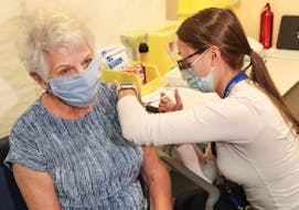 Bernice Brown, 82, of Halifax, receives her vaccine from Allison Milley, RN at the IWK Health Centre. Bernice is the first senior in Nova Scotia to receive her vaccine in a community-based vaccination clinic.