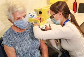 Bernice Brown, 82, of Halifax, receives her vaccine from Allison Milley, RN at the IWK Health Centre. Bernice is the first senior in Nova Scotia to receive her vaccine in a community-based vaccination clinic.