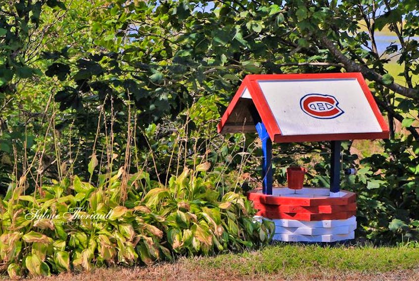 Sylvie Theriault has an eye for beautiful things -she also knows that I am a huge Montreal Canadiens' fan.  She came across this wishing well while driving through Clare, N.S., late last month. She says "maybe the wish is for the Habs to win the cup next year".  Wouldn't that be nice!  Meanwhile, I'm also wishing for more rain to top up the wells in the area.