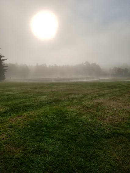 Fog in Paradise…who knew?  Brian Dauphinee had an early tee-off time at the Eden Golf club in West Paradise NS on Saturday.  No word on what he shot, but this shot of Hole #3 is worth bragging about.  The sun coming up through a bank of heavy radiation fog was, in his words, “eerily beautiful”.