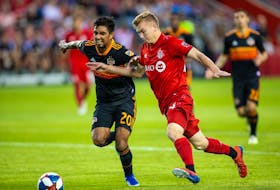 Toronto FC attacker Jacob Shaffelburg, right, battles for the ball against Houston Dynamo defender A. J. DeLaGarza during a July 20 MLS game at BMO Field. Kevin Sousa/USA TODAY Sports