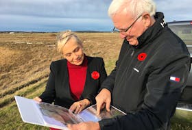 Bill Casey and Cumberland-Colchester MP-elect Lenore Zann look over cut stones that are remnants of the Chignecto Marine Ship Railway in Fort Lawrence. The working and stones have been left as they were when the project collapsed in 1890, but now they are falling into the Bay of Fundy.