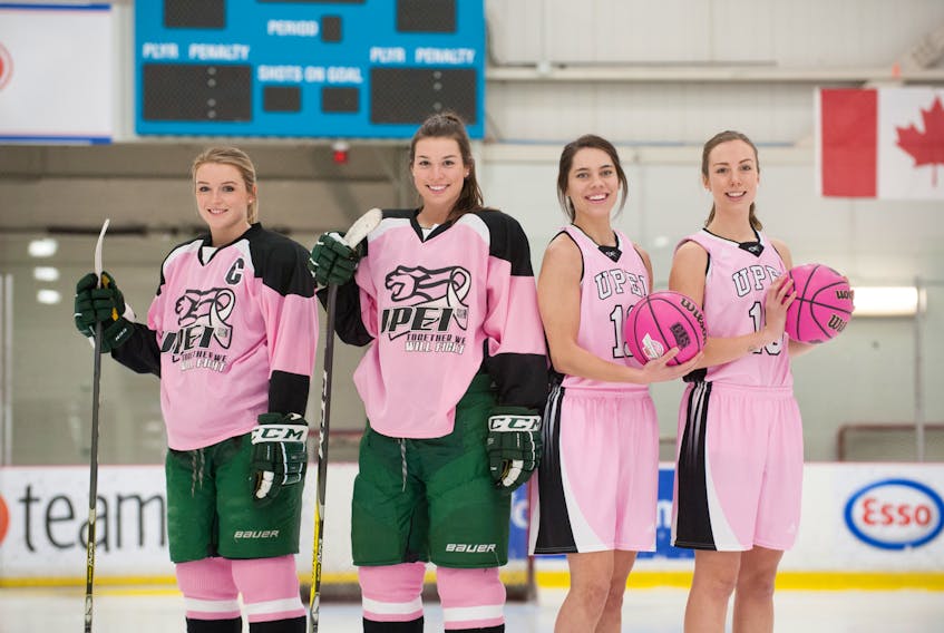 The UPEI Panthers women's hoops and hockey teams are holding fundraisers Saturday to fight cancer. From left are Emma Martin, Emily March, Kiera Rigby and Julie Campbell.