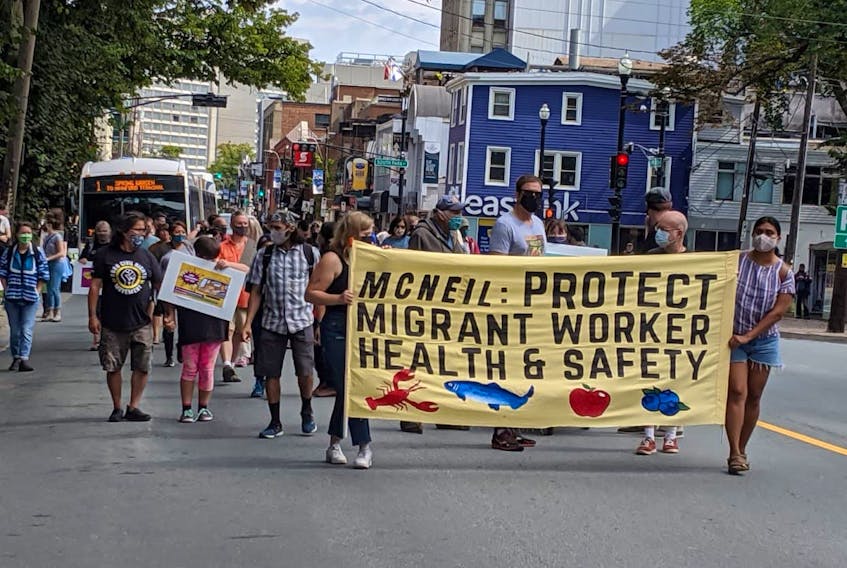 Demonstrators march in a Fight for $15 and Fairness rally on Labour Day, 2020. - Tim Krochak
