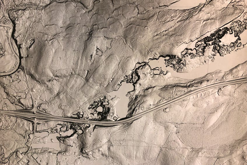 A photo of a preliminary LIDAR map of the region around Oxford, obtained by Cumberland-Colchester MP Bill Casey, shows the presence of what could be multiple sinkholes near the Trans-Canada Highway. The sinkhole in the Lions Park is near the lower left corner. The number of sinkholes in the area and a perceived threat to the highway has prompted Casey to write to both the provincial and federal transportation ministers asking for additional study.