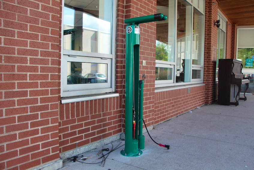 The new bike repair stand at the People’s Place Library in downtown Antigonish. According to library staff, many local cyclists are availing themselves of the useful stand set up outside the library on Main Street – one that is ideal for tune-ups or a quick tire pump-up.