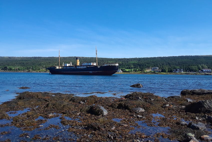 Stories stowed away on this steamship

This lovely photo was submitted by Gary Mitchell, of St. John's NL.  This steamship - the SS Kyle - was built in 1912, and according to Gary, ran aground in Harbour Grace Newfoundland in 1967, where it sits today.