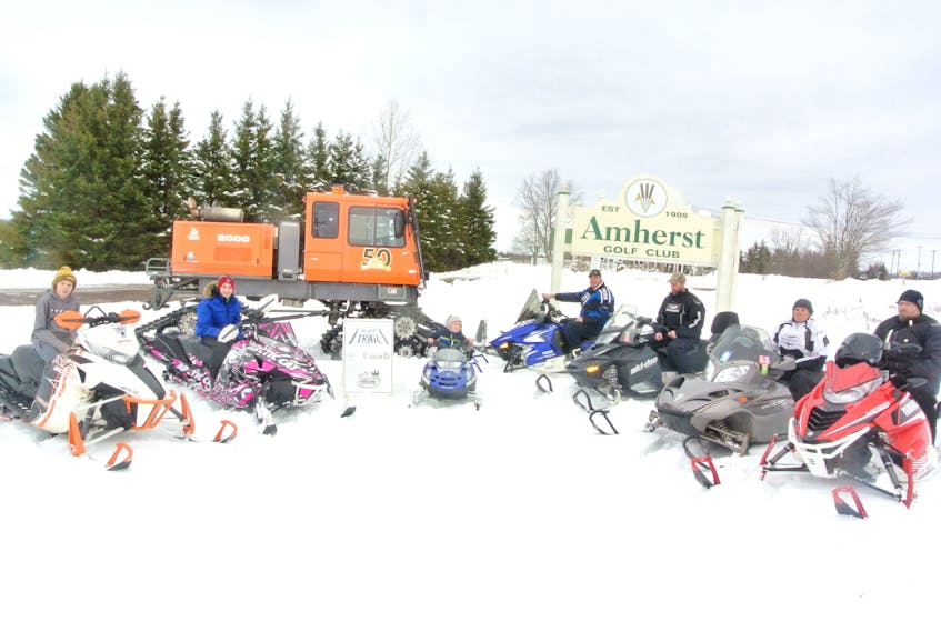 Members of the Cumberland Snowmobile Club celebrate the latest Dream Ride Lottery at the Amherst Golf Club on Nov. 24. The draw, the featured music by Second Toe as well as an auction, raised $23,000 to support its activities.
