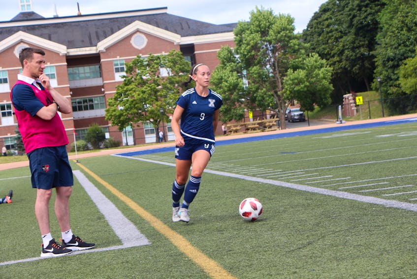 Catherine Kennedy of the X-Women controls the ball during a scrimmage game on Aug. 22.