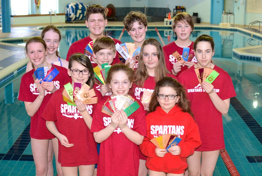 Spartans Swimmers display the huge number of ribbons they earned over the past few months. The Spartans, seen here at their home pool at the YMCA of Cumberland in Amherst, are: (front, from left) Evangeline Thibedeau, Olivia Elliot, Gemma Leslie-Dowe, (middle, from left) Reagan Bushen, Simon Buske, Kassie Doyle, Kaitlin Doyle, (back, from left) Olivia Bacon, Adelynn Fisher, Ava Taggart, and Adam Bobadilla-Amaran.
