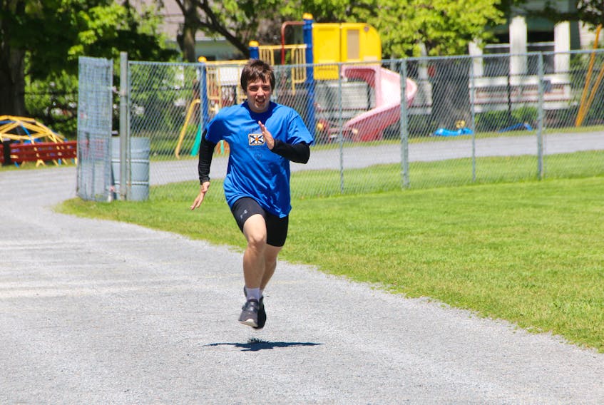 Anthony James works out on the track at the TAAC grounds. He will be competing in 100m, 200m, and 400m races at this year’s Special Olympics.