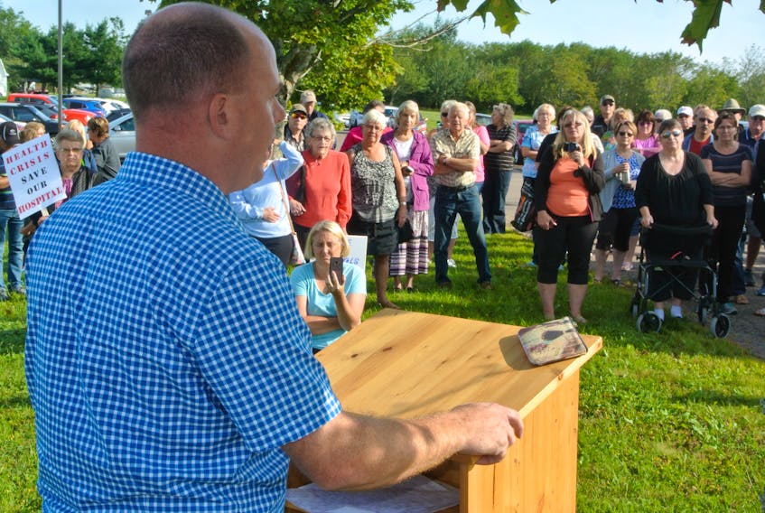 Cumberland South MLA Tory Rushton addresses a crowd of approximately 200 during a health-care rally in front of the All Saints Collaborative Emergency Centre in Springhill.