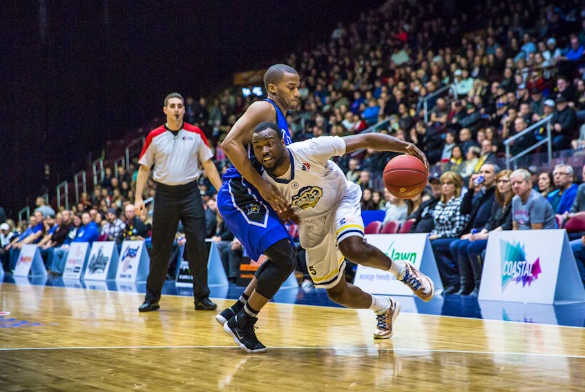 Desmond Lee (right) led the St. John's Edge with 22 points and nine rebounds in a 120-113 win over the KW Titans before a big crowd of more than 4,000 Friday night at Mile One Centre.