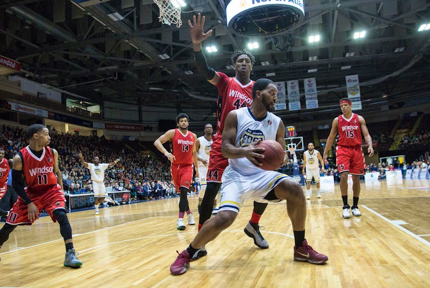 Ryan Reid of the St. John's Edge looks to move the ball as he's guarded by Damontre Harris of the Windsor Express during Game 1 of their National Basketball League of Canada divisional semifinal Friday night at Mile One Centre. The Edge won 123-120 in double overtime. — St. John's Edge photo/Jeff Parsons