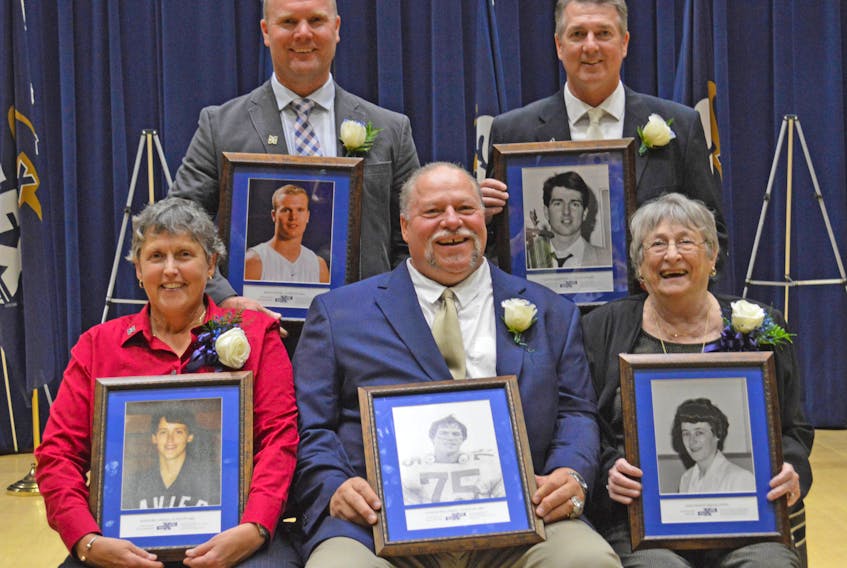 The Class of 2018 for the St. F.X. Sports Hall of Fame includes Adele Belliveau (seated, left), Eugene Belliveau, Jane Hanley-MacGillivray, Randy Nohr (back, left) and Glenn MacDougall. The induction ceremony took place Sept. 27 as part of St. F.X. Homecoming festivities. Paul Hurford
