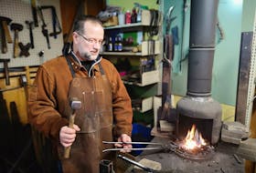 Ian Gillies has been all over the world as a technician for bands like Gowan, but he’s more at home now in his shed with his homemade forge. Andrew Waterman/The Telegram