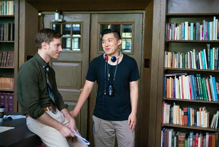Stealing School director Li Dong consults with actor Jonathan Keltz between takes. A student at Dalhousie Law School in the 2000s, Dong's film premieres on iTunes and AppleTV on June 23. - Game Theory Films