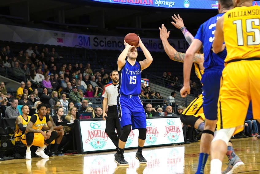 Kyle Arseneault takes a shot while playing with the Kitchener-Waterloo Titans of the National Basketball League of Canada.