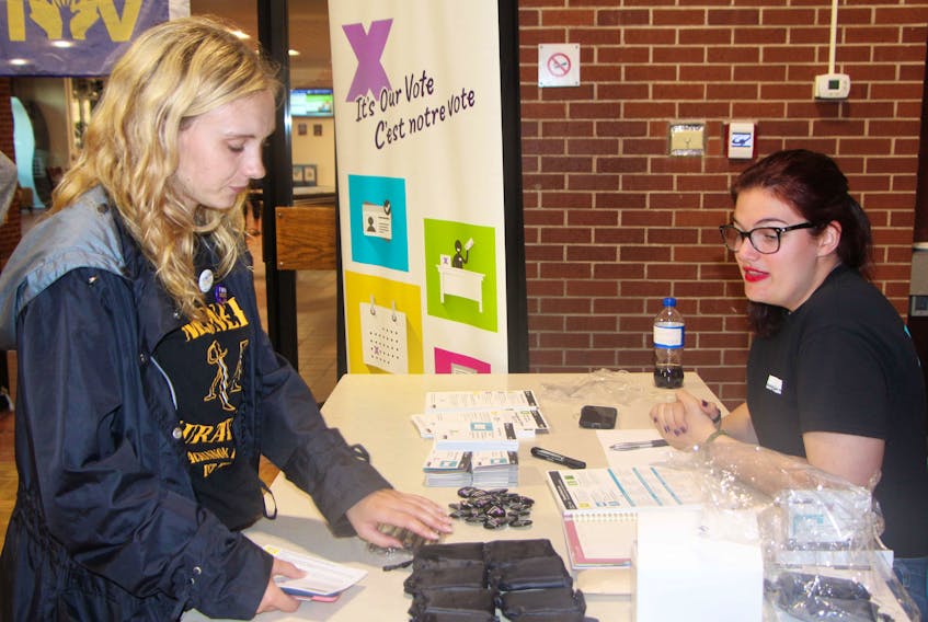 St. F.X. student Jaidyn Ciufo chats with Megan Waddington, community relations officer with Elections Canada, during the Get out the Vote campaign launch event, Sept. 27, at St. F.X. the informative and fun event was hosted by St. F.X. Student Union.