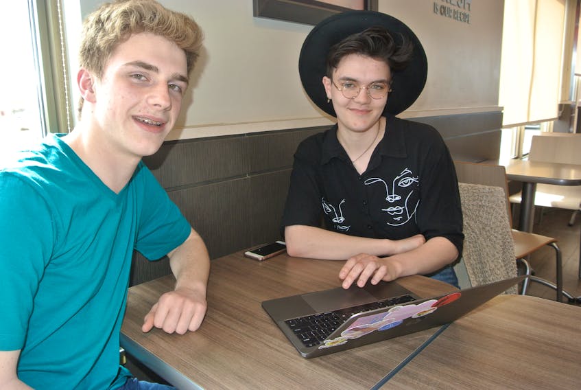 Dan Osborne (left) and Mason Carter are among a group of Amherst Regional High School students urging governments at all levels to acknowledge the growing climate change crisis and take steps to address it.