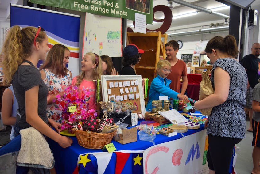 These École Acadienne de Truro students enjoyed a brisk trade at the Truro Farmers Market on Saturday, selling everything from fridge monster magnets to Tic Tac Toe wood products. To break even, the students must make at least $30, to repay the money loaned them to buy supplies.