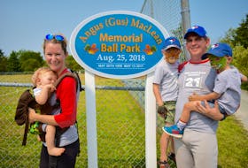 The family of the late Angus (Gus) MacLean were on hand for the renaming of the East Bay baseball field, located behind the local fire department, on Saturday. The field was named in memory of MacLean, a former volunteer firefighter and fastpitch player, who died on May 13, 2017, age the age of 66, after a battle with cancer. From left, Ariane MacLean, Ted MacLean, Alex MacLean, Scott MacLean (Angus’ son) and Andrew MacLean.