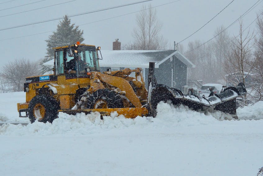 A day after warm temperatures and sunny skies had many Cape Breton residents dreaming of summer, they woke up Sunday to a blanket of snow after as much as 30 cm fell across the area. Above, a plow belonging to Sydney-based contractor Delios makes its way up a Whitney Pier street on Sunday morning.