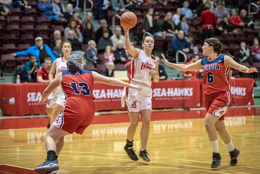 Sydney Ezekiel, shown making a pass during a weekend game against the Acadia Axewomen at the Field House in St. John's, is one of three members of the Memorial Sea-Hawks among the top seven scorers in the AUS women's basketball conference. — Memorial Athletics photo