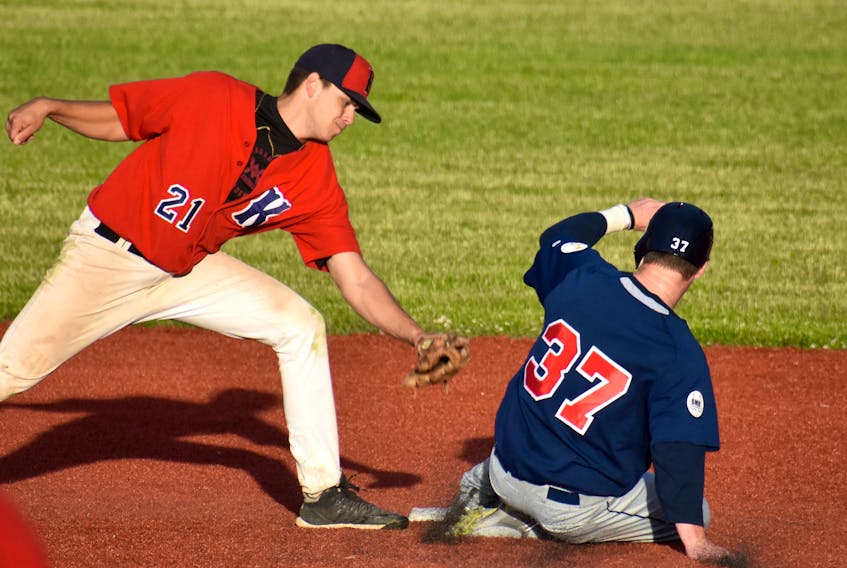 Walker O’Connor of the Sydney Sooners, right, slides safely into second base as Zack Zinck of the Kentville Wildcats prepares to slap the tag during Nova Scotia Senior Baseball League action at the Susan McEachern Memorial Ball Park on Friday.