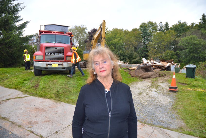 Sylvia Dolomont poses for a photograph following the October 2017 demolition of her North Sydney home.