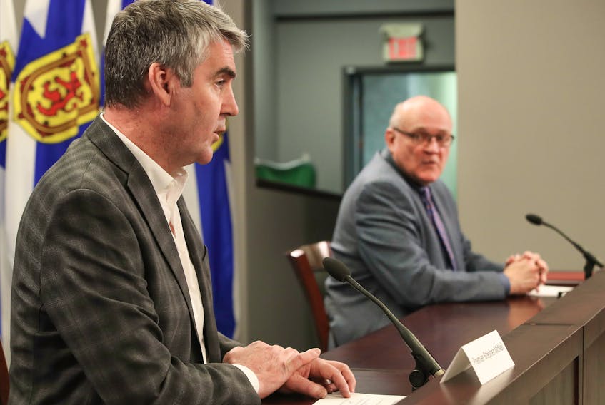 Dr. Robert Strang, Nova Scotia's chief medical officer of health, looks on as Premier Stephen McNeil gives an update on COVID-19 in Nova Scotia on Wednesday, April 1, 2020.