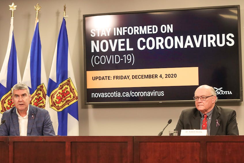 Premier Stephen McNeil and Dr. Robert Strang, chief medical officer of health, speak to the media during a COVID-19 teleconference Friday in Halifax.