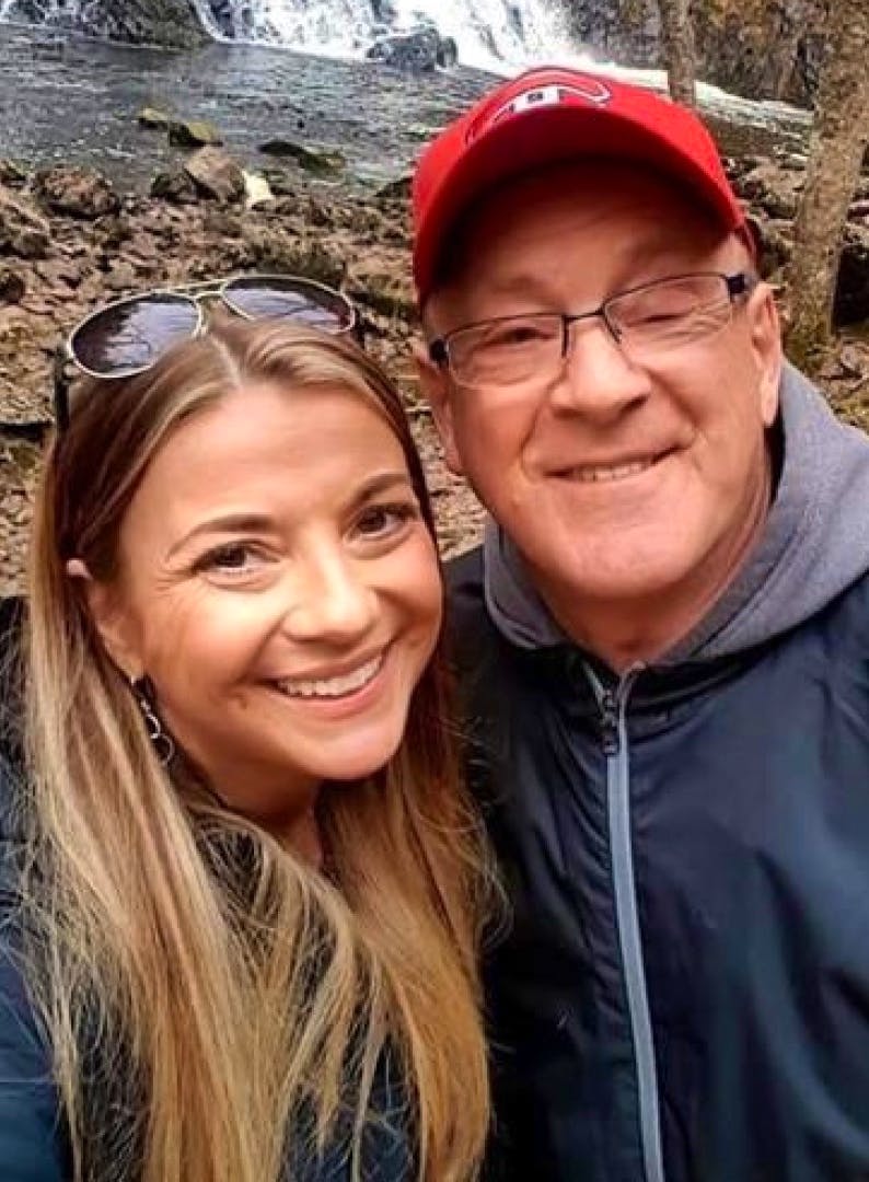 Kelly Marshall, left, and her father Rick Cameron take a selfie while visiting a waterfall in Nova Scotia. Cameron is finally on his road to recovery after being in ICU in the Colchester East Hants Health Centre in Truro with COVID-19 for more than a month.