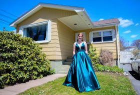 Bridget Gillespie, a Citadel High School grad, is seen in her prom dress at her Halifax home Thursday May 14, 2020. Gillespie is helping to organize a virtual prom.