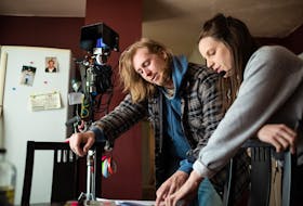 Bone Cage director and star Taylor Olson goes over a scene with producer Melani Wood on the set of the Nova Scotia-shot feature which debuts locally via FIN Stream online film festival, starting Thursday.