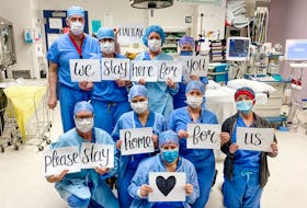 Operating room staff at the QE II Halifax Infirmary are putting a human face on the need for social distancing and self-isolation with a photo that has been widely shared on social media this week.