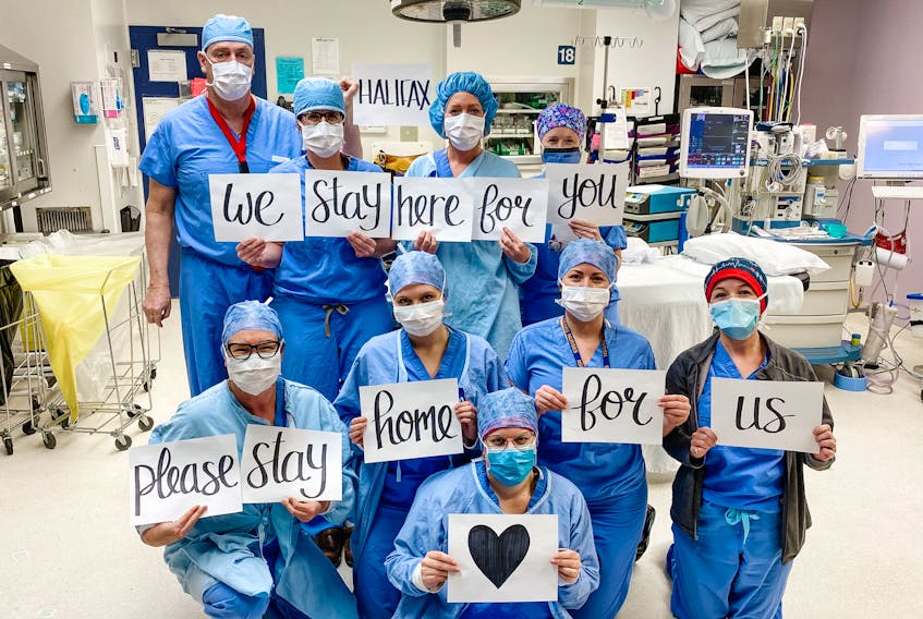 Operating room staff at the QE II Halifax Infirmary are putting a human face on the need for social distancing and self-isolation with a photo that has been widely shared on social media this week.