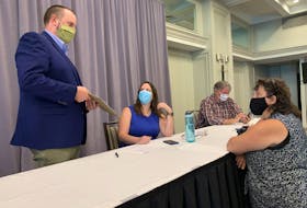 From left to right: Paul Wozney, NSTU president, chats with Nova Scotia Parents for Public Education members Christine Emberley, Adam Davies and Stacey Rudderham at a news conference in Halifax on Thursday, Aug. 27, 2020.