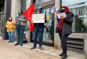 About a dozen people rallied in front of One Government Place on Barrington Street in Halifax on Saturday, Jan. 30, 2021, demanding action from the soon-to-be new Nova Scotia Liberal on the housing crisis.