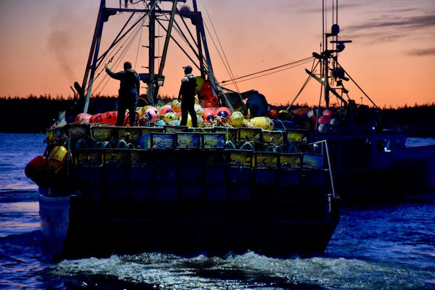 Lobster vessels head out to the lobster fishing grounds to set their gear on the dumping day in southwestern Nova Scotia.