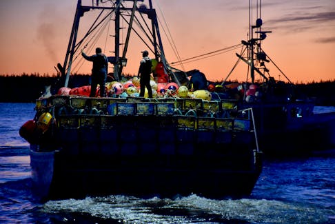 Lobster vessels head out to the lobster fishing grounds to set their gear on the dumping day in southwestern Nova Scotia.