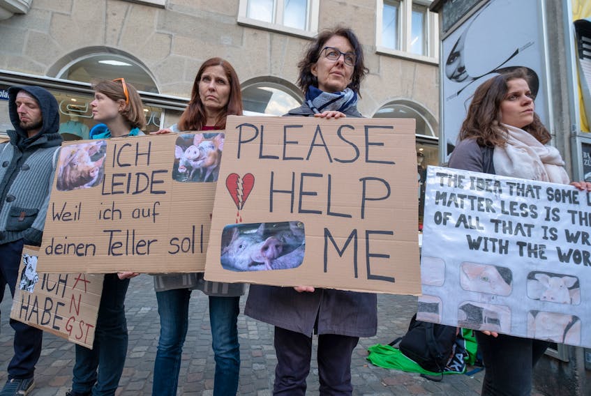Farmers must find a way to bridge the rural/urban divide to convince consumers they treat their animals ethically, says Sylvain Charlebois. People all over the world, such as these protesters in Zurich, Switzerland, have taken part in street demonstrations against the killing of farm animals.